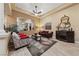 Spacious living room featuring comfortable seating and a stylish area rug at 10372 Hawks Wing St, Las Vegas, NV 89178