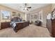Spacious main bedroom with a large bed, ample closet space, and bay windows at 10372 Hawks Wing St, Las Vegas, NV 89178