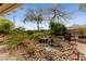 Relaxing backyard oasis with pond and waterfall feature at 10372 Hawks Wing St, Las Vegas, NV 89178