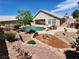 Stunning backyard with pool, firepit, and mature landscaping at 121 E Cypress Dr, Henderson, NV 89015