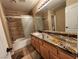 Bathroom with granite vanity, tiled shower and tub at 121 E Cypress Dr, Henderson, NV 89015