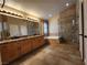 Elegant bathroom with double vanity, soaking tub, and walk-in shower at 121 E Cypress Dr, Henderson, NV 89015