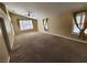 Main bedroom with large window, carpet, and ceiling fan at 121 E Cypress Dr, Henderson, NV 89015