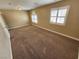 Spacious bedroom with neutral walls, carpet, and window shutters at 121 E Cypress Dr, Henderson, NV 89015