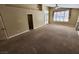 Spacious main bedroom with large window and access to a walk-in closet at 121 E Cypress Dr, Henderson, NV 89015