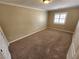 Spacious carpeted bedroom with neutral walls and window at 121 E Cypress Dr, Henderson, NV 89015
