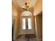 Elegant entryway with double doors and chandelier at 121 E Cypress Dr, Henderson, NV 89015