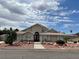 Single-story home with attractive landscaping and a large driveway at 121 E Cypress Dr, Henderson, NV 89015