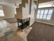 Modern fireplace with stone surround in the living room at 121 E Cypress Dr, Henderson, NV 89015