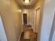 Clean hallway with tile floors and access to bedrooms at 121 E Cypress Dr, Henderson, NV 89015