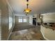 Spacious living room featuring tile floors, fireplace, and multiple windows at 121 E Cypress Dr, Henderson, NV 89015