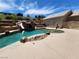 Resort-style backyard oasis featuring a large pool with a waterslide and waterfall at 121 E Cypress Dr, Henderson, NV 89015