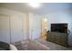 Relaxing bedroom with large TV and dresser at 161 Petaluma Valley Dr, Las Vegas, NV 89138