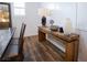 Elegant dining room features a rustic wood console table and modern light fixture at 161 Petaluma Valley Dr, Las Vegas, NV 89138