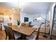 Elegant dining room with a large wooden table and modern lighting at 161 Petaluma Valley Dr, Las Vegas, NV 89138