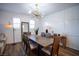 Modern dining room with wood table and stylish light fixture at 161 Petaluma Valley Dr, Las Vegas, NV 89138
