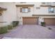 Two-car garage with brick paver driveway at 161 Petaluma Valley Dr, Las Vegas, NV 89138