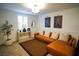 Spacious living area with a leather sectional sofa and stylish decor at 161 Petaluma Valley Dr, Las Vegas, NV 89138