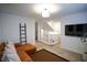 Open loft with a leather sectional sofa and access to upper hallway at 161 Petaluma Valley Dr, Las Vegas, NV 89138