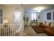 Upstairs loft area features a comfortable lounge, laundry closet, and built-in shelving at 161 Petaluma Valley Dr, Las Vegas, NV 89138
