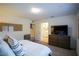 King-size bed, dresser, and ensuite bathroom access at 161 Petaluma Valley Dr, Las Vegas, NV 89138