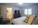 Main bedroom with king bed, ensuite bath access, and dresser at 161 Petaluma Valley Dr, Las Vegas, NV 89138