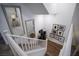 Modern white staircase with mirrors and artwork at 161 Petaluma Valley Dr, Las Vegas, NV 89138