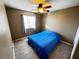 Bedroom with tile flooring, a ceiling fan, and a double bed at 1808 Cedar Bluffs Way, Las Vegas, NV 89128