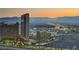 Aerial view of city skyline at sunset, featuring various buildings and mountain range in background at 222 Karen Ave # 2601, Las Vegas, NV 89109