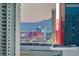 Night view of the city skyline, featuring illuminated buildings and distant mountains at 222 Karen Ave # 2601, Las Vegas, NV 89109