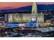 Night view of Strat Hotel and Casino, illuminated at dusk with mountain backdrop at 222 Karen Ave # 2601, Las Vegas, NV 89109