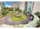 Circular driveway entrance to a luxury high-rise building with lush landscaping at 222 Karen Ave # 2601, Las Vegas, NV 89109