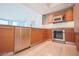 Modern kitchen with wood cabinets, granite counters, and stainless steel appliances at 222 Karen Ave # 2601, Las Vegas, NV 89109