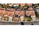 Bird's-eye view of a residential area with houses and palm trees at 2356 Weaverville Dr, Henderson, NV 89044