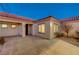 Residential home exterior with front entryway and landscaping at dusk at 2356 Weaverville Dr, Henderson, NV 89044