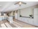 Kitchen features an island, white appliances, and gray cabinets at 2356 Weaverville Dr, Henderson, NV 89044