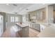 Well-equipped kitchen featuring gray cabinets, an island, and tile flooring at 2356 Weaverville Dr, Henderson, NV 89044