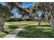 Landscaped community grounds with walkways and trees at 2471 Sabado St, Las Vegas, NV 89121