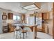 Well-equipped kitchen with oak cabinets and island at 3331 Palmdesert Way, Las Vegas, NV 89120