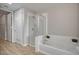 Bathroom with soaking tub, shower, and modern finishes at 353 E Bonneville Ave # 457, Las Vegas, NV 89101