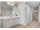 Modern bathroom with double vanity, large mirror, and walk-in shower at 353 E Bonneville Ave # 457, Las Vegas, NV 89101