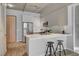Modern kitchen with breakfast bar, two stools, and stainless steel appliances at 353 E Bonneville Ave # 457, Las Vegas, NV 89101