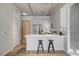 Kitchen features a breakfast bar with two stools and stainless steel appliances at 353 E Bonneville Ave # 457, Las Vegas, NV 89101