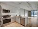 Modern kitchen with island, stainless steel appliances, and open floor plan at 353 E Bonneville Ave # 457, Las Vegas, NV 89101