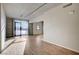 Bright living room with hardwood floors and large windows offering natural light at 353 E Bonneville Ave # 457, Las Vegas, NV 89101