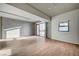 Sunlit living room with hardwood floors and access to balcony at 353 E Bonneville Ave # 457, Las Vegas, NV 89101