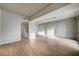 Spacious living area featuring hardwood floors and exposed concrete wall at 353 E Bonneville Ave # 457, Las Vegas, NV 89101