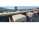 Rooftop patio furniture with city views at 353 E Bonneville Ave # 457, Las Vegas, NV 89101