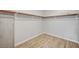 Spacious walk-in closet with wood-look floors and built-in shelving at 353 E Bonneville Ave # 457, Las Vegas, NV 89101