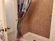 Shower with tiled walls and patterned curtain at 3550 Bay Sands Dr # 2088, Laughlin, NV 89029